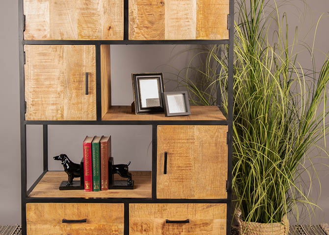 A cabinet with a bookshelf and photo frames.